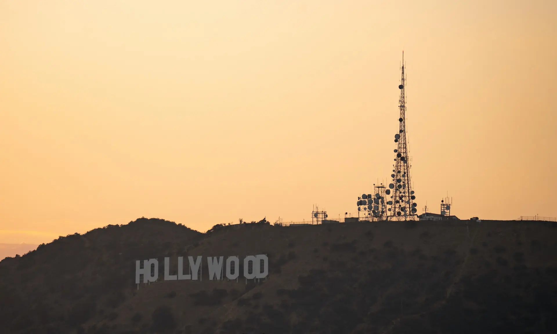 The Hollywood sign on the hills above Los Angeles at dusk